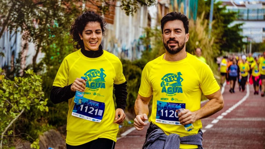 Two athletes participating in a marathon, showing determination and joy.